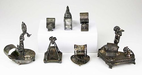 lot of 7 silver plated figural napkin rings incl; owl, putti, rooster, lion, chick, wishbone, croquet mallets
