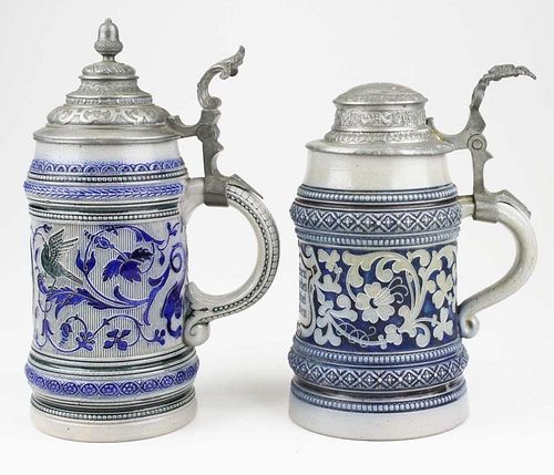 two early 20th c German blue & white steins, ht 8.5”, 10”
