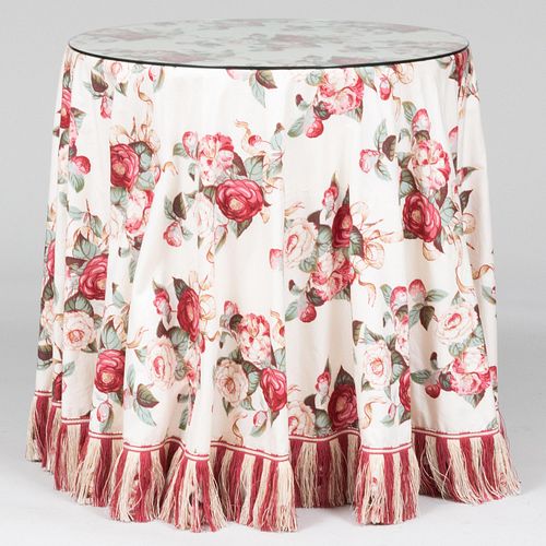 Two Contemporary Circular Tables Draped with Red and Rose Printed Chintz Fabric
