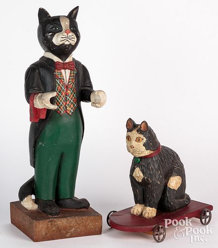 Two carved and painted cats, to include a Rebecca