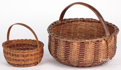 Two splint gathering baskets, 19th c., with staine
