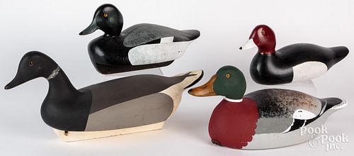 Four carved and painted duck decoys, to include a