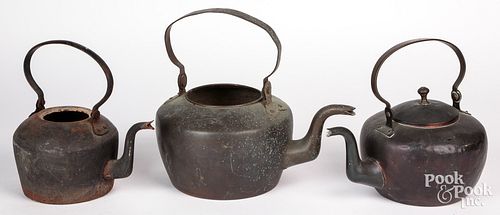 Three copper swing handle teapots, early 19th c.