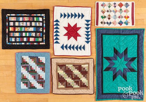 Six contemporary cradle/doll quilts, most Amish
