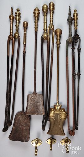 Large group of fireplace tools and a tool rest