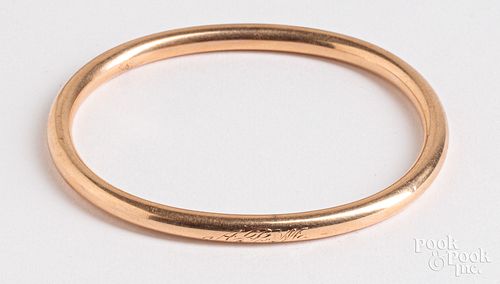 14K gold bangle bracelet dated 1906, 8.6 dwt.