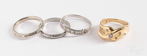Three 18K gold rings and a platinum ring