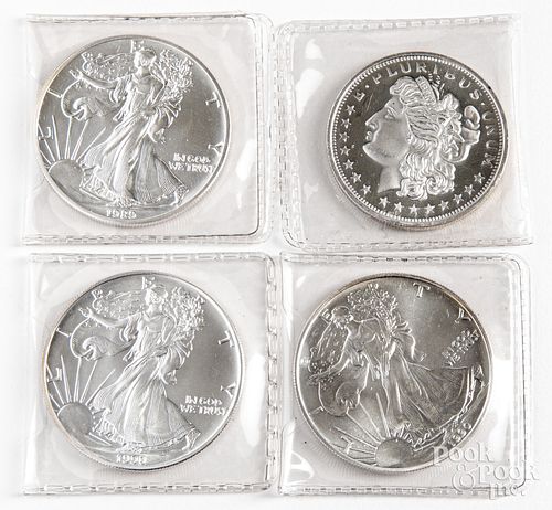 Four 1 ozt. fine silver coins.