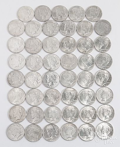 Forty-seven 1924 Peace silver dollars.