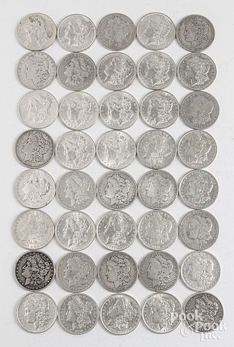 Forty Morgan silver dollars.