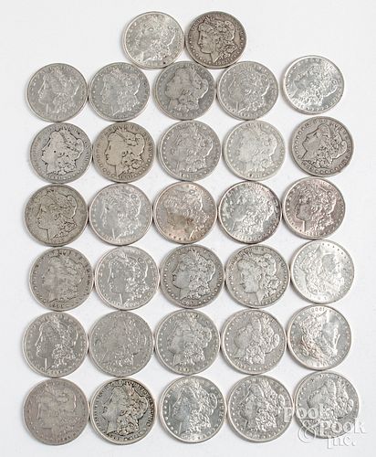 Thirty-two Morgan silver dollars.