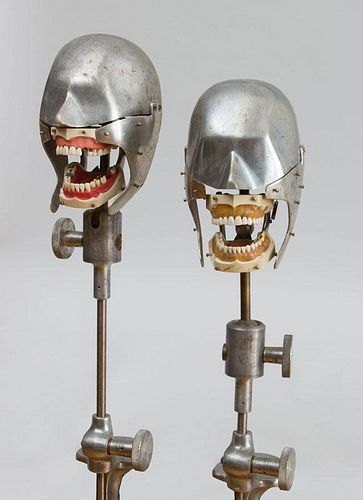 COLUMBIA DENTOFORM CORP: TWO PLASTIC TEETH MODELS, IN ALUMINUM SKULLS WITH ADJUSTABLE CLAMP SUPPORTS