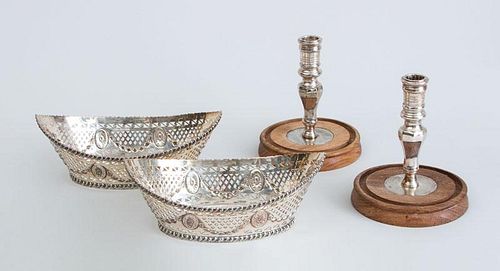 PAIR OF ENGLISH SILVER-PLATED PIERCED BOAT-FORM BOWLS AND A PAIR OF MODERN INDIAN SILVER-PLATED CANDLESTICKS ON WOOD BASES