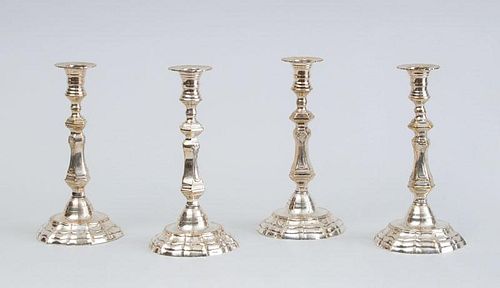 SET OF FOUR LOUIS XV STYLE SILVER-PLATED CANDLESTICKS