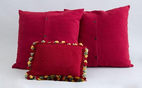 TASSELED MAROON-GROUND PILLOW AND PAIR OF MAROON-GROUND PILLOWS