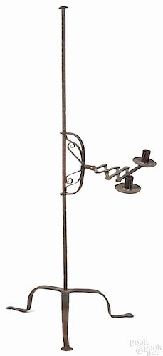 English wrought iron candlestand, late 18th c., with an accordion candlearm, 43'' h.