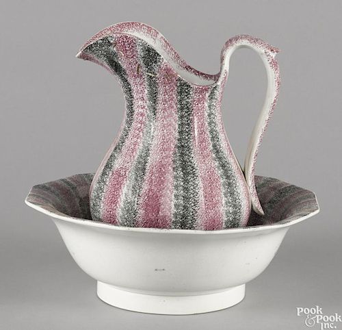 Purple and black rainbow spatter pitcher and basin, pitcher - 11 1/4'' h., basin - 4 1/2'' h.