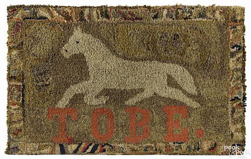 American hooked rug of a horse, late 19th c., inscribed TOBE., 25'' x 40''.