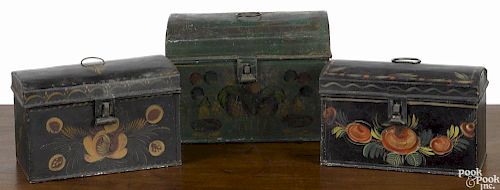 Three toleware dome lid boxes, 19th c., the largest with stenciled fruit on a green ground