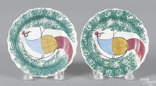 Pair of teal spatter toddy plates with peafowl decoration, 4 1/2'' dia.