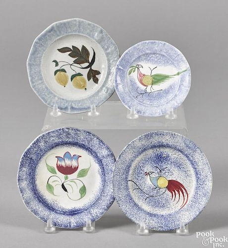 Four blue spatter toddy plates, to include one with a tulip, one with an acorn