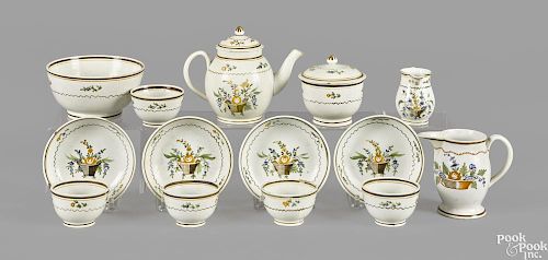English miniature pearlware tea service, 19th c., with basket of flower decoration