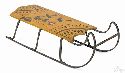Painted sled, late 19th c., retaining its original yellow surface with floral highlights