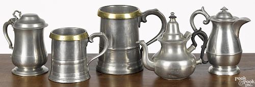 Two English pewter measures, 19th c., together with a teapot, a syrup, and a small tankard
