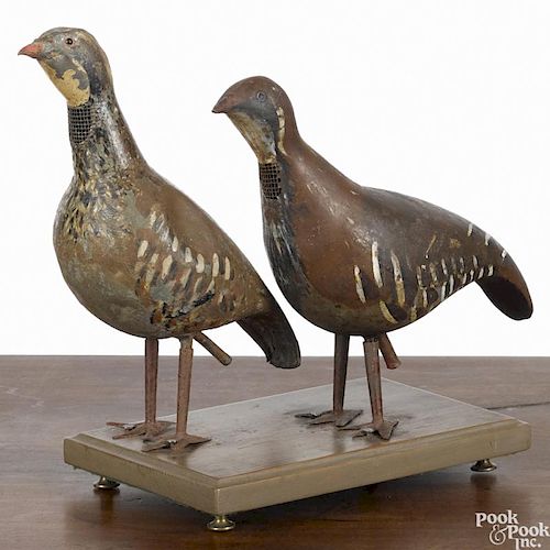 Two English painted tin partridge decoys, late 19th c., 9'' h.
