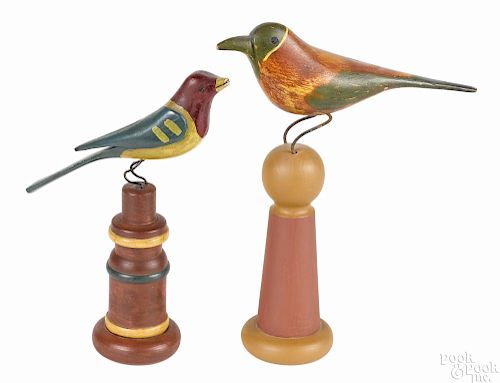 Two carved and painted birds, early 20th c., on later turned plinths, 7 3/4'' h. and 9'' h.