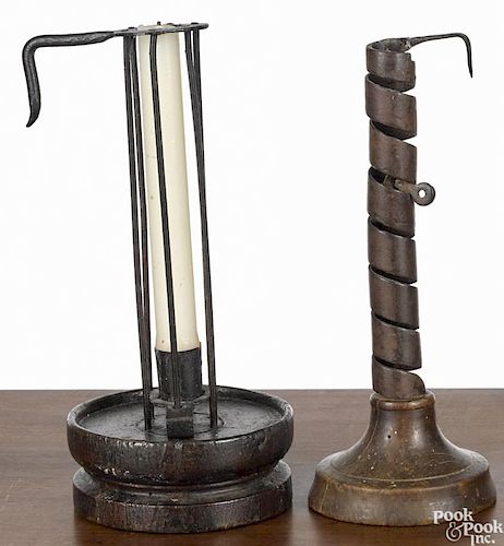 Two primitive wrought iron candlesticks, late 18th c., with turned wood bases