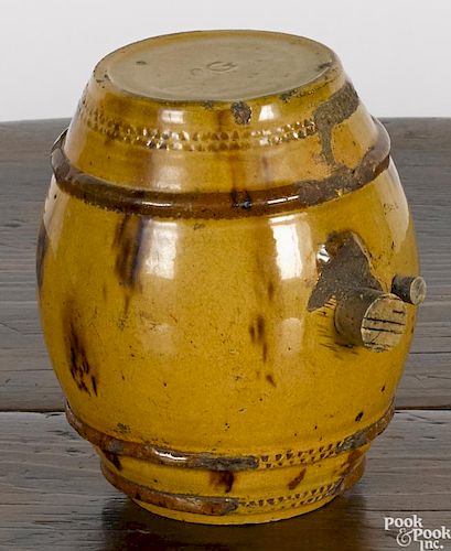 Redware rundlet, 19th c., initialed GW, with yellow glaze and manganese splotches, 5 5/8'' h.