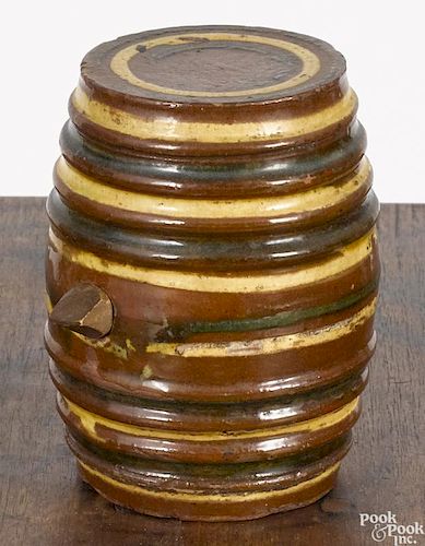 Pennsylvania or Maryland redware rundlet, 19th c., with yellow and green slip bands, 4 1/2'' h.