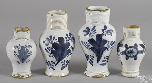 Four Delft blue and white jugs, 18th c., 5'' - 7'' h.