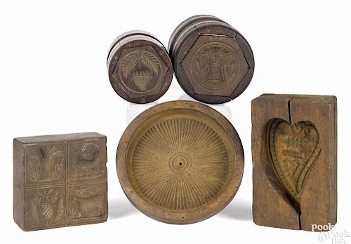 Five carved butterprints, 19th c., to include two barrel examples, a large pinwheel example