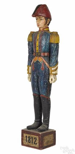 Carved and painted figure of a soldier, mid 20th c., 72'' h.