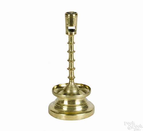 Northwestern European tall brass candlestick, 15th c., with a round socket and square apertures