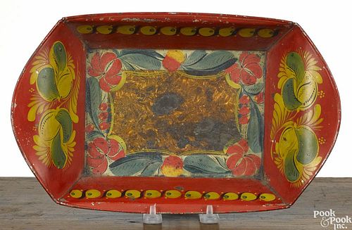 Pennsylvania toleware bread tray, 19th c., with bold floral decoration on a red background