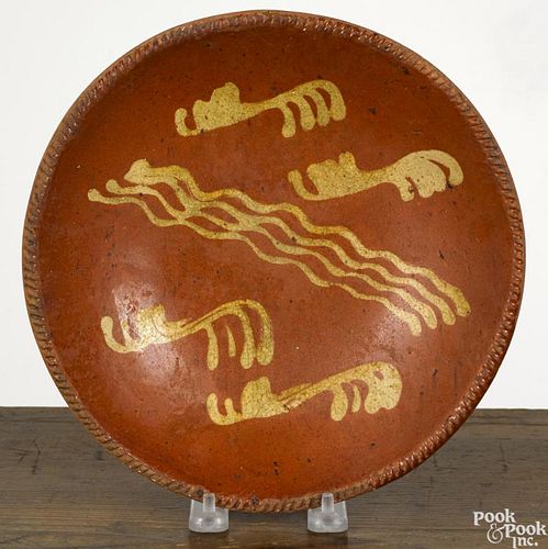 Pennsylvania redware pie plate, 19th c., with yellow slip decoration, 9 3/8'' dia.