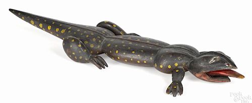 Carved and painted lizard, late 19th c., retaining its original polka dot decoration, 16 1/2'' l.