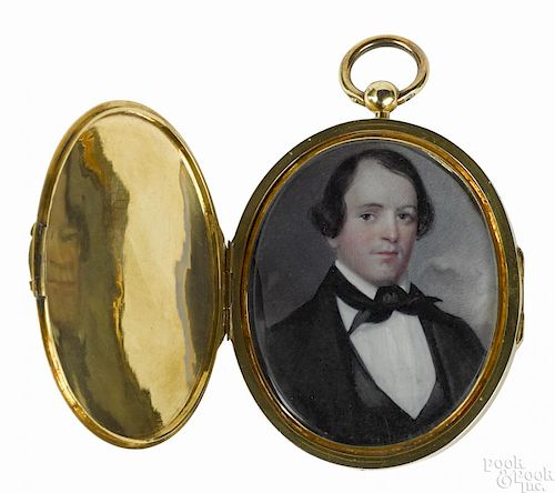 Miniature portraits on ivory of a husband and wife, 19th c., framed in a chased gold locket