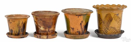 Four Pennsylvania and Shenandoah Valley, Virginia redware flowerpots, 19th c., 4 1/4'' - 6 3/8'' h.