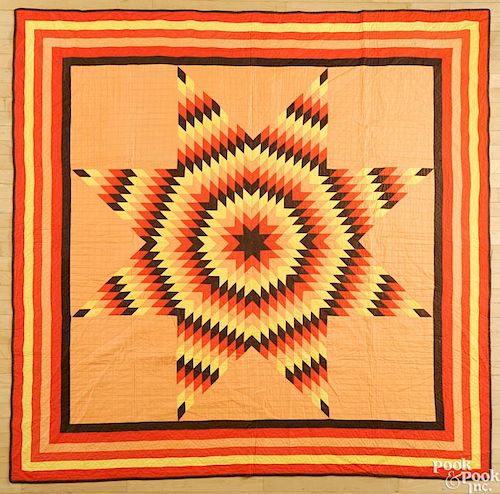 Pennsylvania lone star quilt, early 20th c., with a striped border, 83'' x 83''.