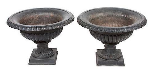 A Pair of Victorian Iron Garden Urns Height of each 22 x diameter 31 inches.