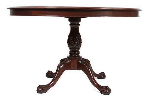 A Victorian Style Mahogany Circular Dining Table Height 31 x diameter 53 inches.