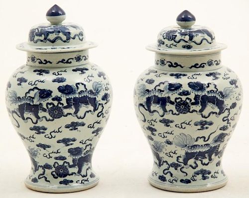 PAIR OF ORIENTAL BLUE AND WHITE CAPPED JARS