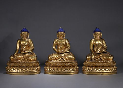 3 copper buddha statues