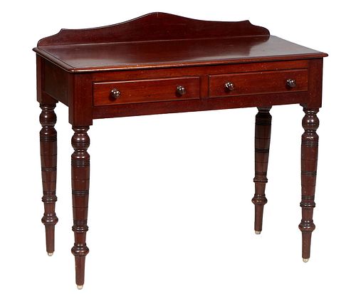 English Late Victorian Mahogany Writing Table, late 19th c., with an arched back splash over a stepped rounded edge and corner rectangular top above t