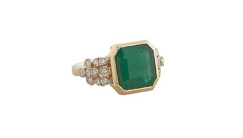 Lady's 14K Yellow Gold Dinner Ring, with a rectangular 6.25 ct. emerald within an octagonal gold border, the lugs mounted with small round diamonds, t