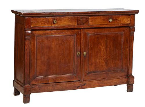 French Empire Carved Cherry Sideboard, mid 19th c., the rectangular top over two setback frieze drawers above double cupboard doors, flanked by tapere